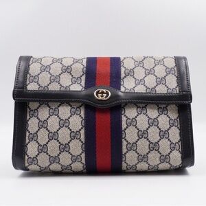 Gucci GG Canvas Clutch with Blue and Red Web Stripe